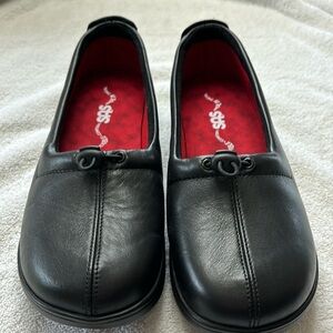 Never worn black slip on SAS Women’s shoes. Size 8 wide.